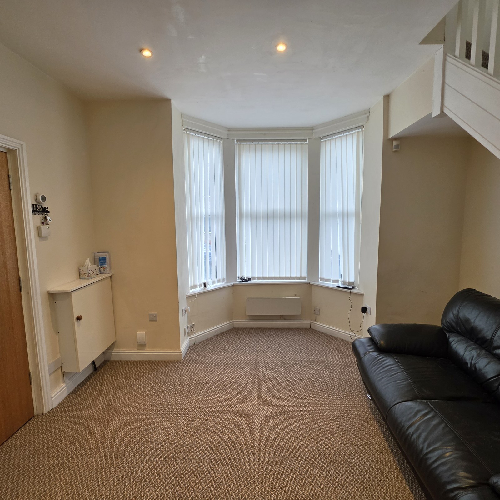 A bright living area with a bay window